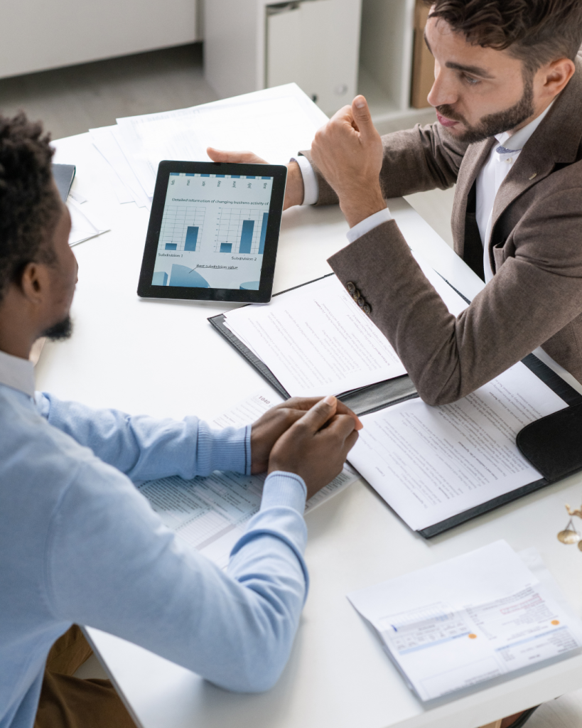 Financial advisor discussing business loan options with minority entrepreneur